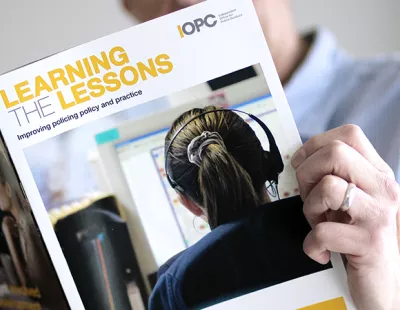 Man reading IOPC Learning the Lessons magazine