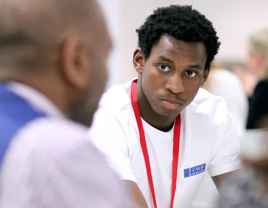 Two black men in discussion