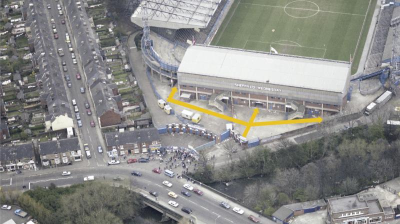 Aerial photo of Leppings Lane end at Hillsborough Stadium, with arrows showing spectator entry routes to the West Terrace and North West Terrace on the day of the disaster