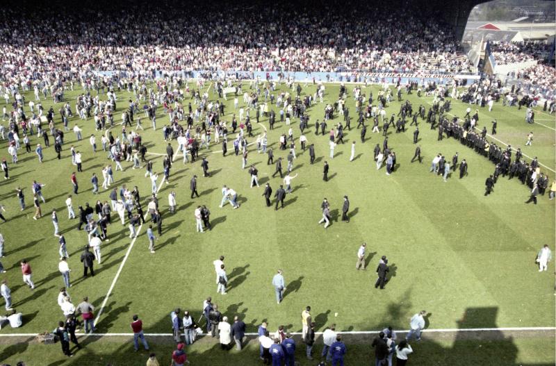 A police cordon in front of the Spion Kop at Hillsborough Stadium at 15:38:30